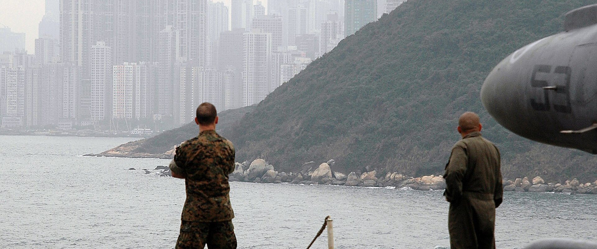 US Navy 060125-N-2256V-002 Marines aboard the amphibious assault ship USS Tarawa (LHA 1) observes the sites of