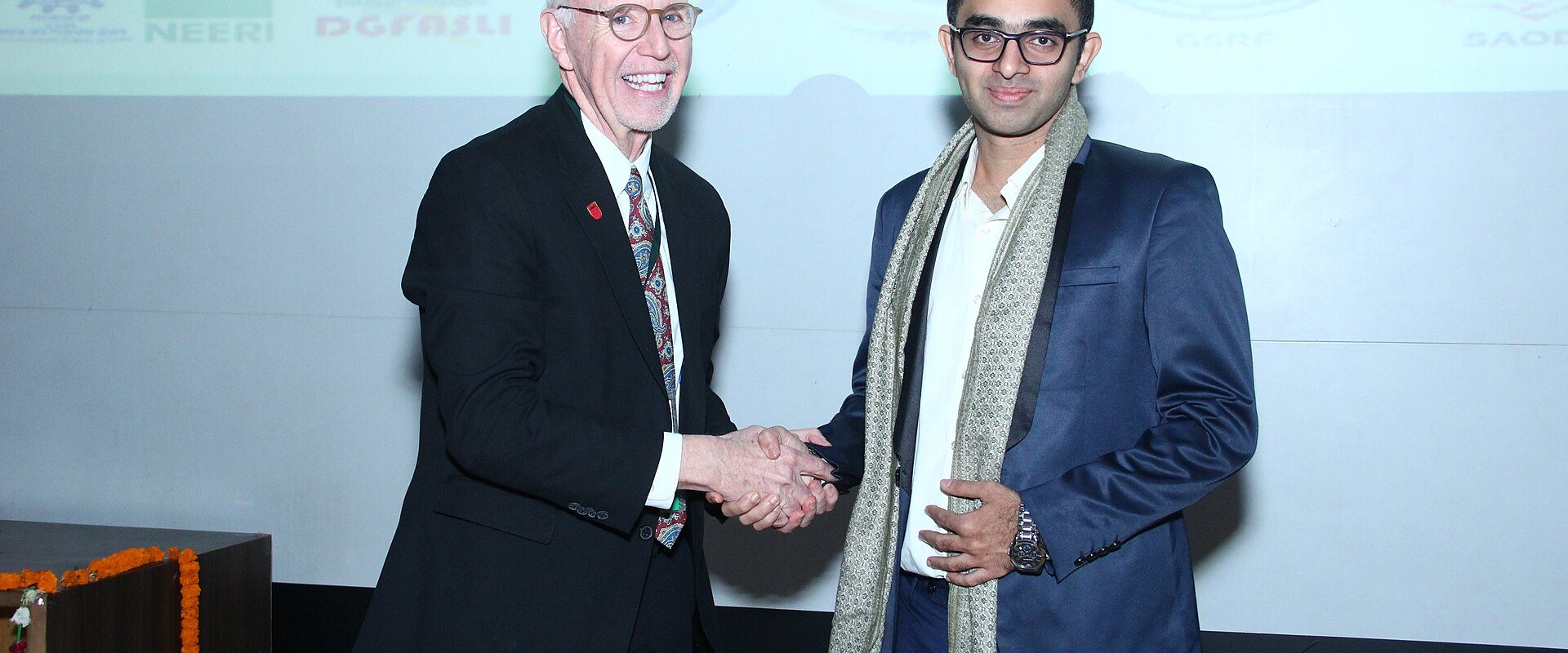 Dean of Rutgers University, Dr Mark Robson felicitating Dr Edmond Fernandes in the United States